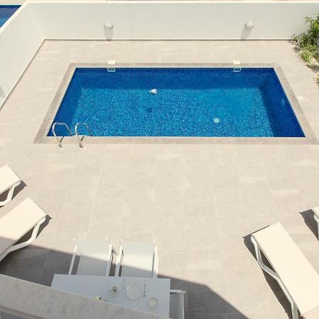 Palm Tree Villas Livadhia Экстерьер фото